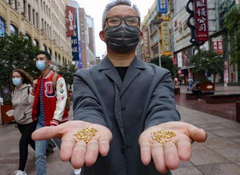 警省众人粮食名贵 艺术家企图将1000颗杂金大年夜米投进黄浦江