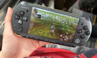 Japanese player takes out PSP to play with monster hunting at the subway station. Primary school students next to him ta